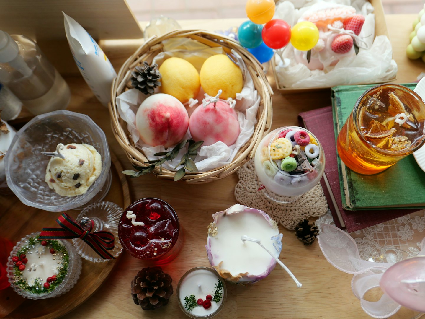An assortment of decorative candles and snacks displayed on a table.